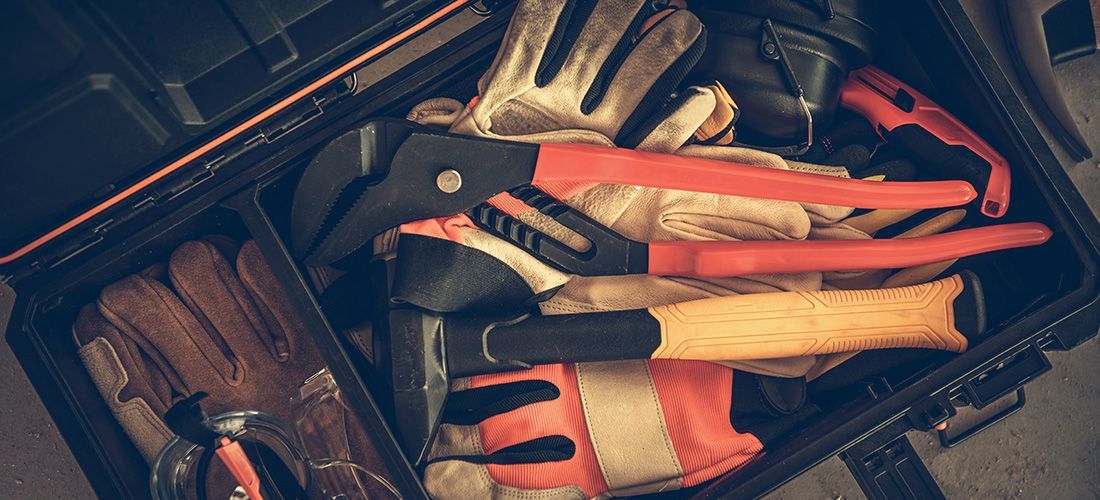tool box with tools, gloves and glasses