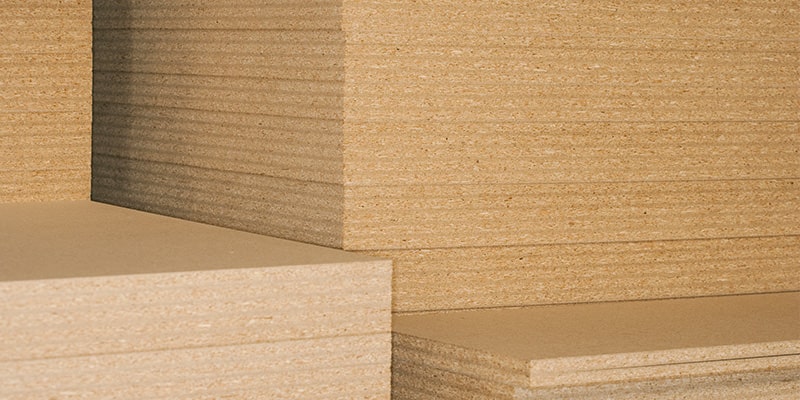 Hundreds of plywood boards stacked atop one another.